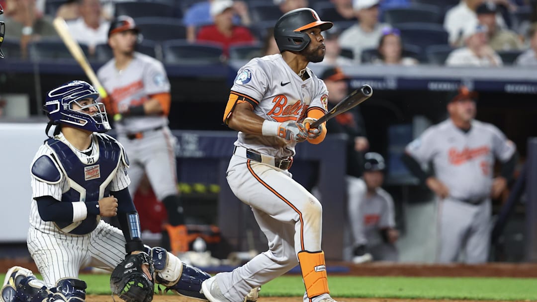 Jun 19, 2024; Bronx, New York, USA;  Baltimore Orioles center fielder Cedric Mullins (31) hits an RBI single in the tenth inning against the New York Yankees at Yankee Stadium.