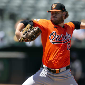 Jul 6, 2024; Oakland, California, USA; Baltimore Orioles pitcher Cole Irvin (19) delivers a pitch against the Oakland Athletics during the fourth inning at Oakland-Alameda County Coliseum. Mandatory Credit: D. Ross Cameron-USA TODAY Sports