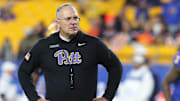 Nov 9, 2024; Pittsburgh, Pennsylvania, USA;  Pittsburgh Panthers head coach Pat Narduzzi observes warm ups before the game against the Virginia Cavaliers at Acrisure Stadium. Mandatory Credit: Charles LeClaire-Imagn Images