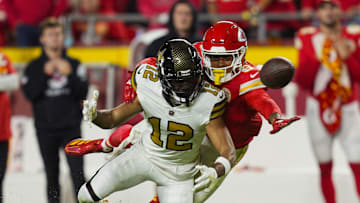 Oct 7, 2024; Kansas City, Missouri, USA; Kansas City Chiefs safety Bryan Cook (6) breaks up a pass intended for New Orleans Saints wide receiver Chris Olave (12) during the second half at GEHA Field at Arrowhead Stadium. Mandatory Credit: Jay Biggerstaff-Imagn Images