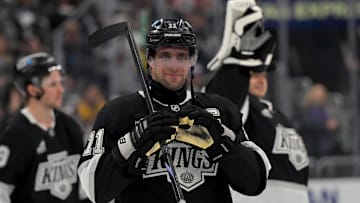 Apr 23, 2025; Los Angeles, California, USA; Los Angeles Kings center Anze Kopitar (11) makes a heart with his gloves for he daughter after defeating the Edmonton Oilers in game 2 of the 2025 Stanley Cup Playoffs at Crypto.com Arena. Mandatory Credit: Jayne Kamin-Oncea-Imagn Images