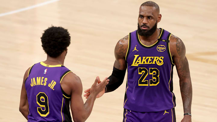 Feb 1, 2025; New York, New York, USA; Los Angeles Lakers guard Bronny James (9) checks in for forward LeBron James (23) during the fourth quarter against the New York Knicks at Madison Square Garden. Mandatory Credit: Brad Penner-Imagn Images Feb 1, 2025; New York, New York, USA; Los Angeles Lakers guard Bronny James (9) checks in for forward LeBron James (23) during the fourth quarter against the New York Knicks at Madison Square Garden. Mandatory Credit: Brad Penner-Imagn Images