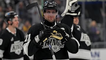 Apr 23, 2025; Los Angeles, California, USA; Los Angeles Kings center Anze Kopitar (11) makes a heart with his gloves for he daughter after defeating the Edmonton Oilers in game 2 of the 2025 Stanley Cup Playoffs at Crypto.com Arena. Mandatory Credit: Jayne Kamin-Oncea-Imagn Images