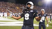 Dec 1, 2018; Orlando, FL, USA; UCF Knights quarterback Darriel Mack Jr. (8) celebrates after a touchdown during the second half against the Memphis Tigers at Spectrum Stadium. Mandatory Credit: Reinhold Matay-Imagn Images