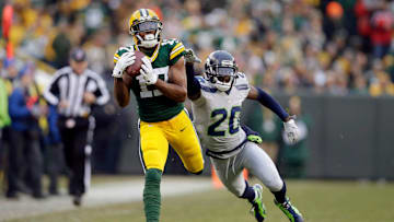 Green Bay Packers wide receiver Davante Adams (17) eludes Seattle Seahawks cornerback Jeremy Lane (20) for a 66 yard touchdown pass from Green Bay Packers quarterback Aaron Rodgers (12) in the first quarter during the Green Bay Packers and Seattle Seahawks NFL football game at Lambeau Field in Green Bay Wisconsin, Sunday, December 11, 2016.