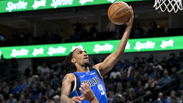 Jan 5, 2024; Dallas, Texas, USA; Dallas Mavericks guard A.J. Lawson (9) drives to the basket past Portland Trail Blazers guard Rayan Rupert (72) during the second half at the American Airlines Center. 