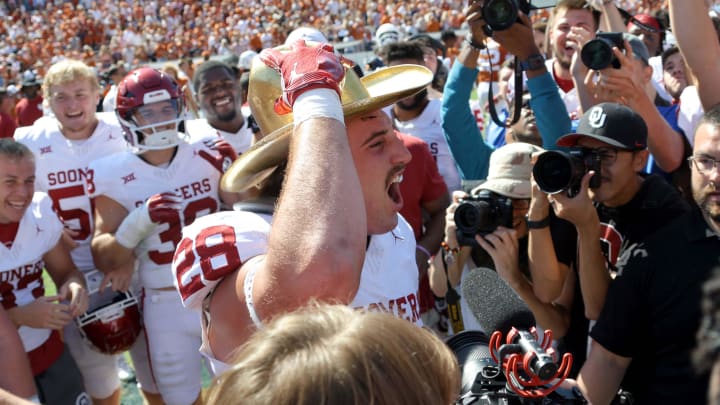 Oklahoma Sooners linebacker Danny Stutsman (28) celebrates with the Golden Hat Trophy after the Red River Rivalry college football game between the University of Oklahoma Sooners (OU) and the University of Texas (UT) Longhorns at the Cotton Bowl in Dallas, Saturday, Oct. 7, 2023. Oklahoma won 34-30.