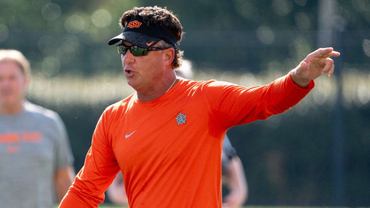 Head coach Mike Gundy walks on the field during an Oklahoma State football practice in Stillwater, Okla., on Saturday, Aug. 3, 2024.