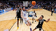 Mar 20, 2025; Denver, CO, USA; Brigham Young Cougars guard Egor Demin (3) drives to the net against VCU Rams forward Luke Bamgboye (9) as forward Jack Clark (4) defends in the second half at Ball Arena. Mandatory Credit: Isaiah J. Downing-Imagn Images
