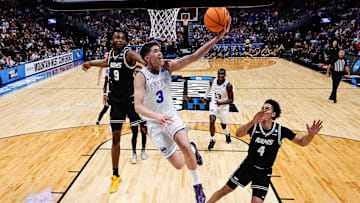 Mar 20, 2025; Denver, CO, USA; Brigham Young Cougars guard Egor Demin (3) drives to the net against VCU Rams forward Luke Bamgboye (9) as forward Jack Clark (4) defends in the second half at Ball Arena. Mandatory Credit: Isaiah J. Downing-Imagn Images