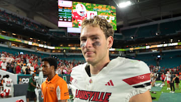 Oct 17, 2025; Miami Gardens, Florida, USA; Louisville Cardinals quarterback Miller Moss (7) looks on after the game against the Miami Hurricanes at Hard Rock Stadium. 
