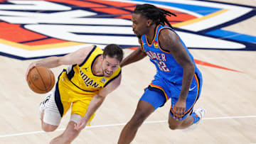 Jun 22, 2025; Oklahoma City, Oklahoma, USA; Indiana Pacers guard T.J. McConnell (9) dribbles against Oklahoma City Thunder guard Cason Wallace (22) during the second half of game seven of the 2025 NBA Finals at Paycom Center. Mandatory Credit: Alonzo Adams-Imagn Images