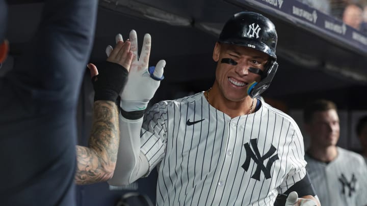 New York Yankees center fielder Aaron Judge (99) celebrates his solo home run with teammates during the sixth inning against the Colorado Rockies at Yankee Stadium on Aug 23.