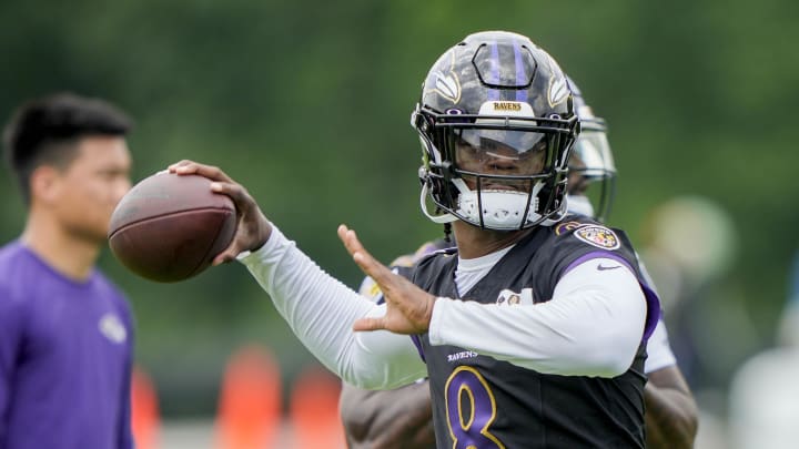 Jul 27, 2023; Owings Mills, MD, USA; Baltimore Ravens quarterback Lamar Jackson (8) passes the ball during training camp practice at Under Armour Performance Center. Mandatory Credit: Brent Skeen-USA TODAY Sports