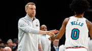 Memphis Grizzlies interim head coach Tuomas Iisalo reacts with forward Jaylen Wells as he checks out of the game.