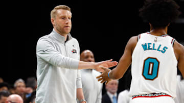 Memphis Grizzlies interim head coach Tuomas Iisalo reacts with forward Jaylen Wells as he checks out of the game.