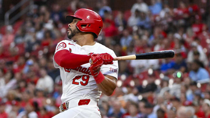 Aug 6, 2024; St. Louis, Missouri, USA;  St. Louis Cardinals left fielder Tommy Pham (29) hits a two run home run against the Tampa Bay Rays during the second inning at Busch Stadium.