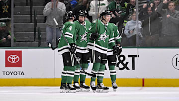 Jan 19, 2025; Dallas, Texas, USA; Dallas Stars defenseman Miro Heiskanen (4) and left wing Jamie Benn (14) and left wing Jason Robertson (21) celebrates a power play goal scored by Robertson against the Detroit Red Wings during the first period at the American Airlines Center. Mandatory Credit: Jerome Miron-Imagn Images