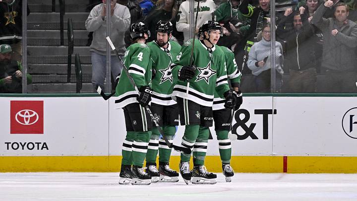Jan 19, 2025; Dallas, Texas, USA; Dallas Stars defenseman Miro Heiskanen (4) and left wing Jamie Benn (14) and left wing Jason Robertson (21) celebrates a power play goal scored by Robertson against the Detroit Red Wings during the first period at the American Airlines Center. Mandatory Credit: Jerome Miron-Imagn Images