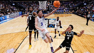 Mar 20, 2025; Denver, CO, USA; Brigham Young Cougars guard Egor Demin (3) drives to the net against VCU Rams forward Luke Bamgboye (9) as forward Jack Clark (4) defends in the second half at Ball Arena. Mandatory Credit: Isaiah J. Downing-Imagn Images