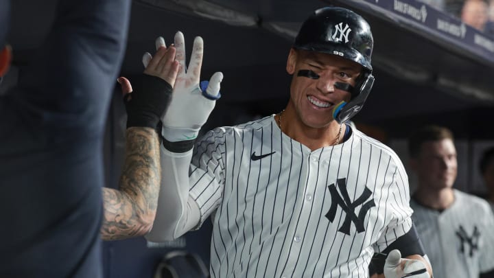 Aug 23, 2024; Bronx, New York, USA; New York Yankees center fielder Aaron Judge (99) celebrates his solo home run with teammates during the sixth inning against the Colorado Rockies at Yankee Stadium. Mandatory Credit: Vincent Carchietta-USA TODAY Sports