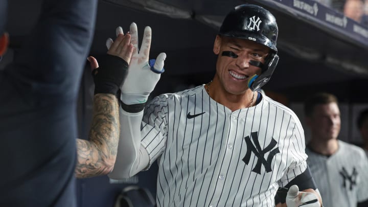 Aug 23, 2024; Bronx, New York, USA; New York Yankees center fielder Aaron Judge (99) celebrates his solo home run with teammates during the sixth inning against the Colorado Rockies at Yankee Stadium. Mandatory Credit: Vincent Carchietta-USA TODAY Sports