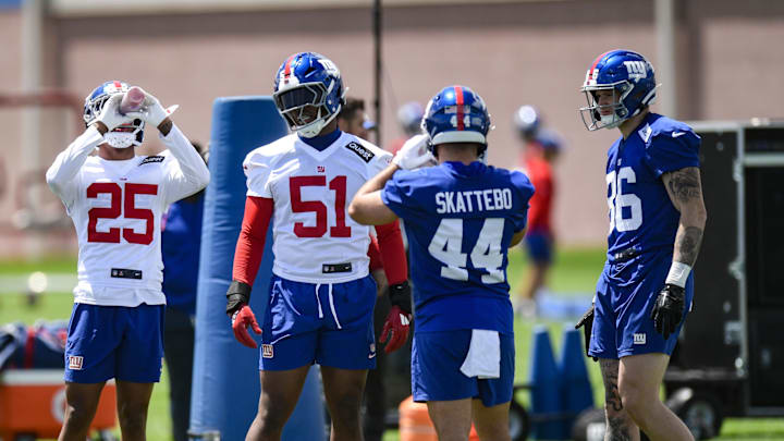 May 10, 2025; East Rutherford, NJ, USA; New York Giants cornerback Korie Black (25), linebacker Abdul Carter (51), running back Cam Skattebo (44) and tight end Thomas Fidone II (86) chat during rookie minicamp at Quest Diagnostics Training Center. Mandatory Credit: John Jones-Imagn Images