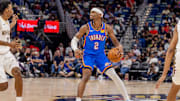 Nov 17, 2025; New Orleans, Louisiana, USA;  Oklahoma City Thunder guard Shai Gilgeous-Alexander (2) dribbles against New Orleans Pelicans center Derik Queen (22) during the first half at Smoothie King Center. Mandatory Credit: Stephen Lew-Imagn Images
