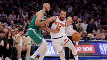 New York Knicks guard Jalen Brunson drives to the basket against Boston Celtics guard Derrick White. Mandatory Credit: Brad Penner-Imagn Images