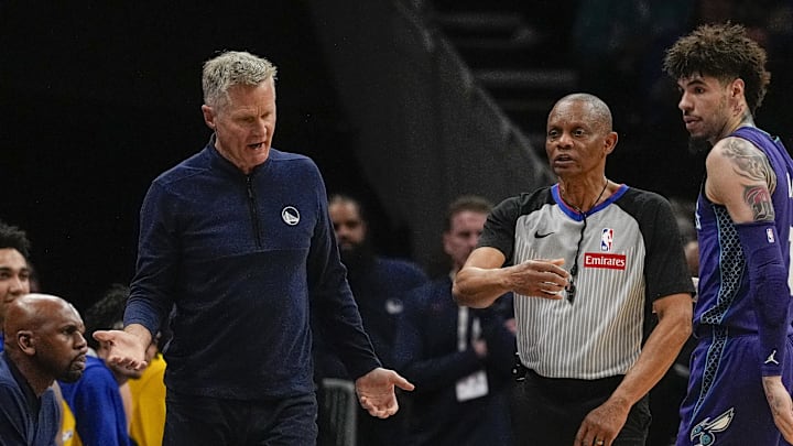 Golden State Warriors head coach Steve Kerr reacts to a call by referee Michael Smith (38) during the second quarter against the Charlotte Hornets at Spectrum Center. Golden State Warriors head coach Steve Kerr reacts to a call by referee Michael Smith (38) during the second quarter against the Charlotte Hornets at Spectrum Center.
