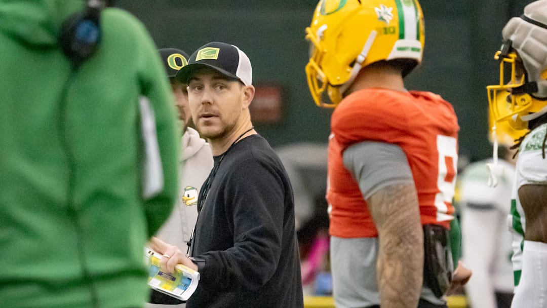 Oregon offensive coordinator and quarterbacks coach Will Stein works with the team as the Oregon Ducks practice ahead of the Rose Bowl Friday, Dec. 27, 2024, at the Moshofsky Center in Eugene, Ore.
