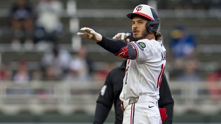 Apr 13, 2026; Minneapolis, Minnesota, USA; Minnesota Twins left fielder Austin Martin (16) celebrates hitting a double against the Boston Red Sox in the first inning at Target Field. Mandatory Credit: Jesse Johnson-Imagn Images