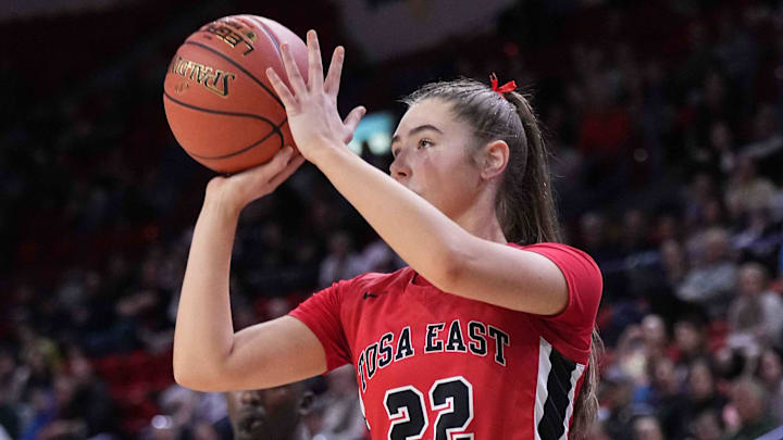 Wauwatosa East's Ellie Deprey (22) elevates for a 3-point shot attempt versus West De Pere in a WIAA Division 2 state semifinal game on March 14, 2025. Wauwatosa East's Ellie Deprey (22) elevates for a 3-point shot attempt versus West De Pere in a WIAA Division 2 state semifinal game on March 14, 2025.