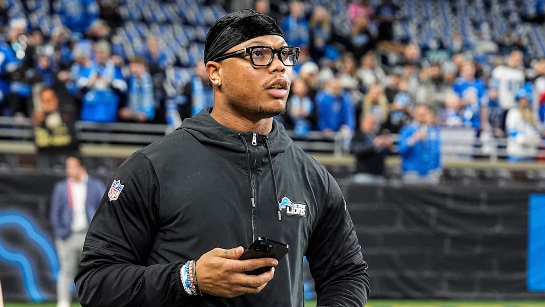 Detroit Lions running back David Montgomery (5) watches warm up before the game between Detroit Lions and Minnesota Vikings at Ford Field in Detroit on Sunday, Jan. 5, 2025.