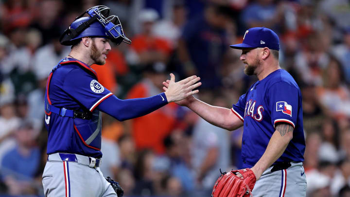 Jul 13, 2024; Houston, Texas, USA; Texas Rangers catcher Jonah Heim (28) congratulates pitcher Kirby Yates (39) after the final out against the Houston Astros during the tenth inning at Minute Maid Park. Mandatory Credit: Erik Williams-USA TODAY Sports