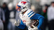 Dec 21, 2024; University Park, Pennsylvania, USA; Southern Methodist Mustangs running back Brashard Smith (1) carries the ball during the second half against the Penn State Nittany Lions at Beaver Stadium.