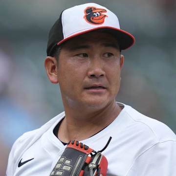 May 15, 2025; Baltimore, Maryland, USA; Baltimore Orioles pitcher Tomoyuki Sugano (19) looks toward the outfield at the end of the second inning against the Minnesota Twins at Oriole Park at Camden Yards. Mandatory Credit: Mitch Stringer-Imagn Images