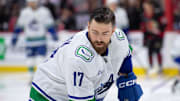 Nov 23, 2024; Ottawa, Ontario, CAN; Vancouver Canucks defenseman Filip Hronek (17) skates with the puck during warmup prior to game against the Ottawa Senators at the Canadian Tire Centre. Mandatory Credit: Marc DesRosiers-Imagn Images