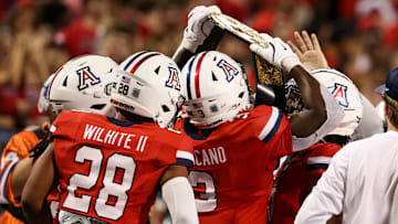 Sep 7, 2024; Tucson, Arizona, USA; Arizona Wildcats running back Kedrick Reescano (3) holds up a belt and celebrates a touchdown with teammates against Northern Arizona Lumberjacks during the fourth quarter at Arizona Stadium