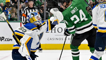 Apr 17, 2024; Dallas, Texas, USA; St. Louis Blues goaltender Jordan Binnington (50) makes a glove save in front of Dallas Stars center Roope Hintz (24) during the second period at the American Airlines Center. Mandatory Credit: Jerome Miron-USA TODAY Sports