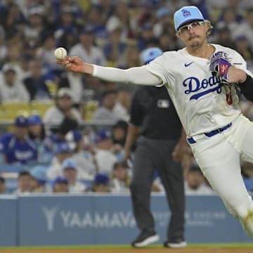 Jul 4, 2025; Los Angeles, California, USA; Los Angeles Dodgers third baseman Enrique Hernandez (8) throws Houston Astros left fielder Shay Whitcomb (10) out at first in the eighth inning at Dodger Stadium. Mandatory Credit: Jayne Kamin-Oncea-Imagn Images