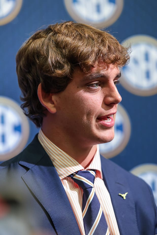 Texas Longhorns quarterback Arch Manning answers questions from the media during SEC Media Days
