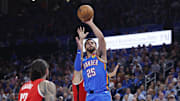 Oct 21, 2025; Oklahoma City, Oklahoma, USA; Oklahoma City Thunder guard Ajay Mitchell (25) shoots against the Houston Rockets during the first half at Paycom Center. Mandatory Credit: Alonzo Adams-Imagn Images