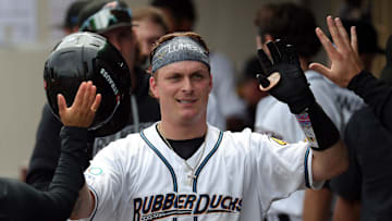 Akron RubberDucks catcher Cooper Ingle (2) celebrates in the dugout after hitting a solo home run against the Altoona Curve on May 20, 2025, in Akron, Ohio.