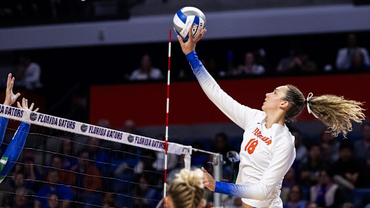 Florida Gators outside hitter Kennedy Martin (18) hits the ball during the first set against the FGCU Eagles in the first round of the NCAA Women   s Volleyball Championship at Exactech Arena at the Stephen C. O'Connell Center in Gainesville, FL on Thursday, November 30, 2023. [Matt Pendleton/Gainesville Sun]