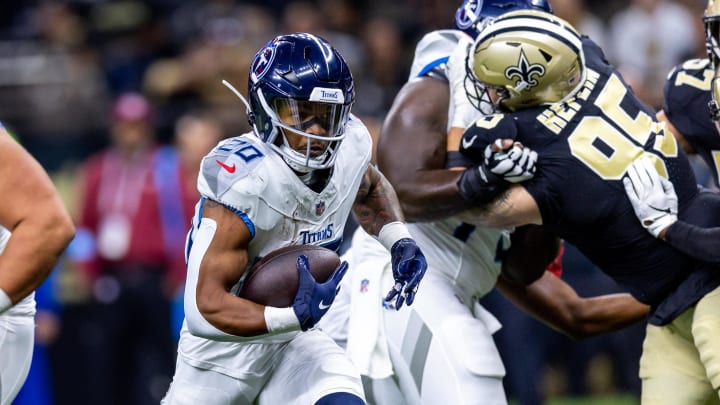 Aug 25, 2024; New Orleans, Louisiana, USA; New Orleans Saints defensive tackle Jack Heflin (95) attempts to shed his blocker to tackle Tennessee Titans running back Tony Pollard (20) during the first half at Caesars Superdome. Mandatory Credit: Stephen Lew-USA TODAY Sports