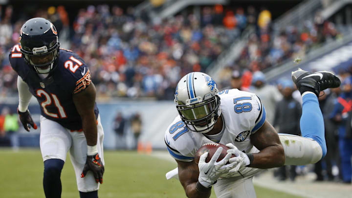 Jan 3, 2016; Chicago, IL, USA; Detroit Lions wide receiver Calvin Johnson (81) catches a touchdown pass against Chicago Bears strong safety Ryan Mundy (21) during the second half at Soldier Field. The Lions won 24-20. Mandatory Credit: Kamil Krzaczynski-Imagn Images Jan 3, 2016; Chicago, IL, USA; Detroit Lions wide receiver Calvin Johnson (81) catches a touchdown pass against Chicago Bears strong safety Ryan Mundy (21) during the second half at Soldier Field. The Lions won 24-20. Mandatory Credit: Kamil Krzaczynski-Imagn Images