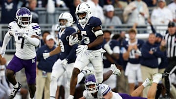 Penn State football wide receiver Devonte Ross (5) runs with the ball after breaking a tackle during the fourth quarter against the Northwestern Wildcats
