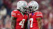 Ohio State wide receivers Jeremiah Smith and Carnell Tate celebrate a big play in the Big Ten championship. 