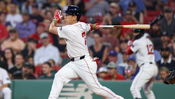 Aug 28, 2024; Boston, Massachusetts, USA; Boston Red Sox designated hitter Masataka Yoshida (7) hits a single during the first inning against the Kansas City Royals at Fenway Park. Mandatory Credit: Paul Rutherford-USA TODAY Sports